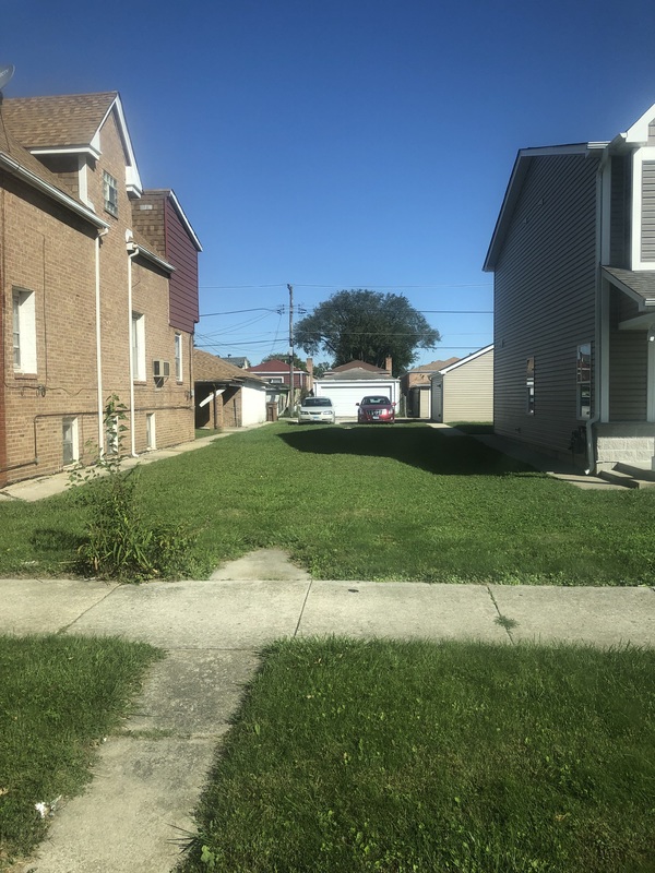 The lot where Emmett Till's first home once stood. It looked like this until 2021, when a sign and a commemorative field of bricks was installed.
